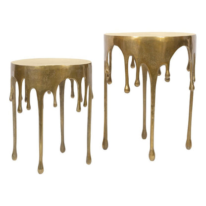 Two bronze tables with artistic, dripping designs.