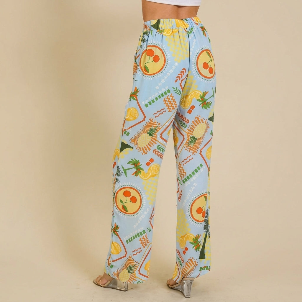Colorful patterned pants with clear heels on a beige background.