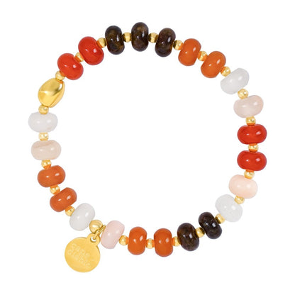 Colorful beaded bracelet with gold accents and charm.