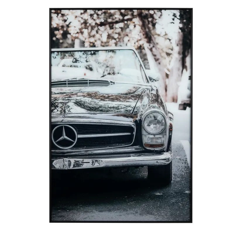 Classic Mercedes-Benz convertible in a serene setting.