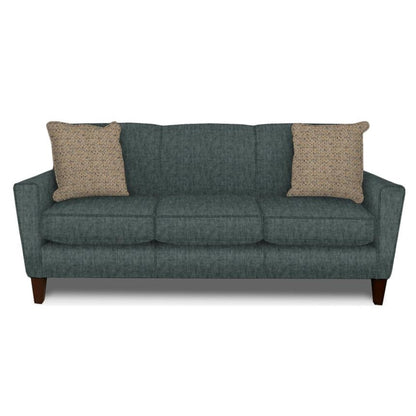 Gray sofa with two beige pillows on a white background.