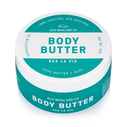 Body butter container labeled "Sea La Vie" with shea butter and aloe.