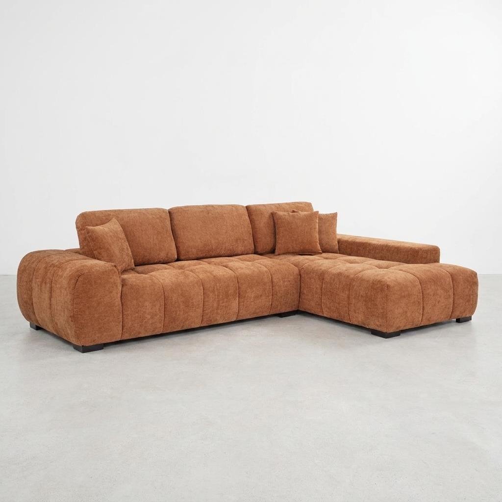 Brown sectional sofa on a light grey floor, minimalist setting.