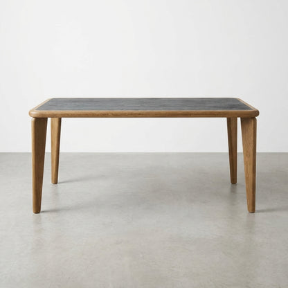 Wooden table with tapered legs and a dark tabletop.