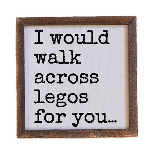 Framed sign with text: "I would walk across legos for you..."