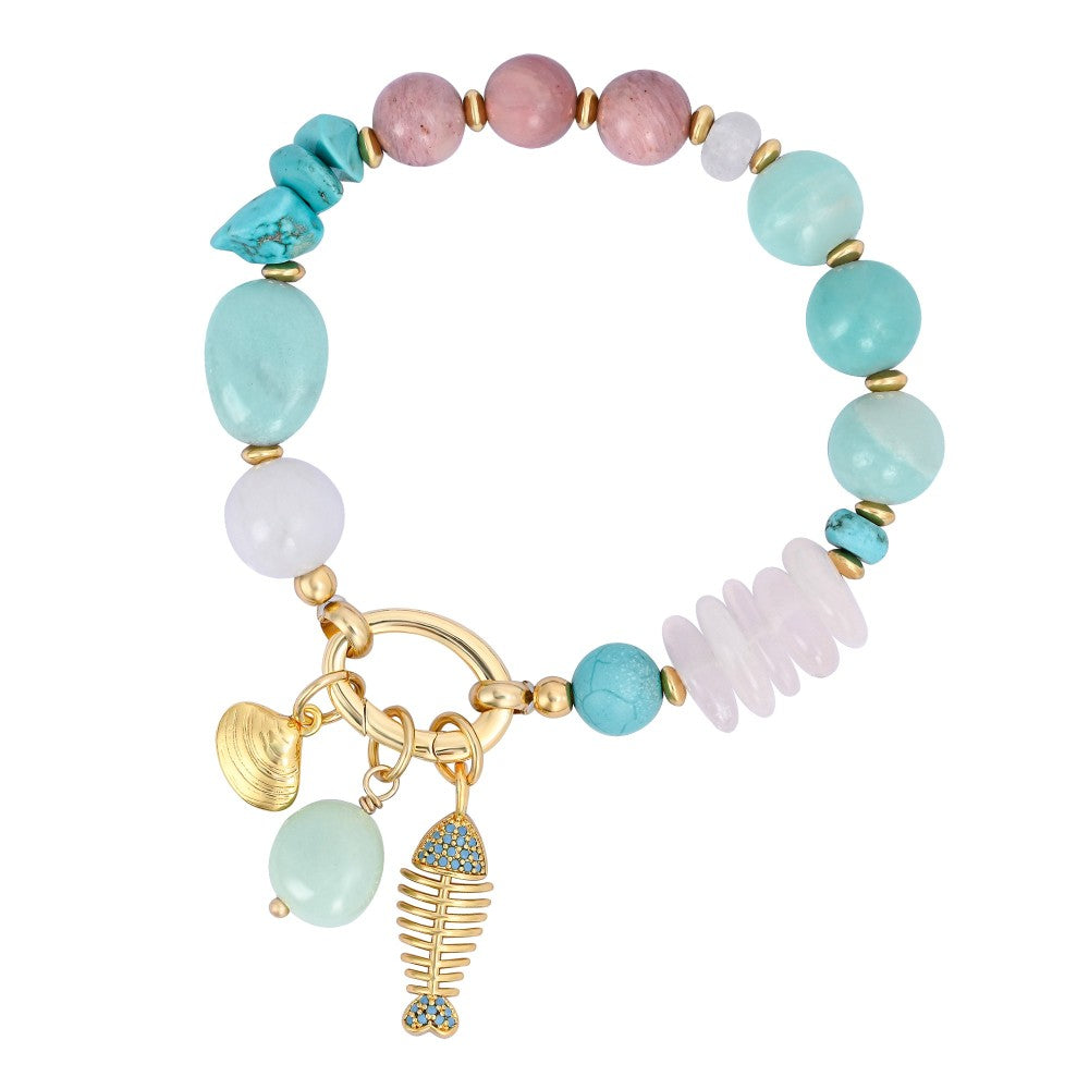 Colorful beaded bracelet with gold charms and a fishbone pendant.