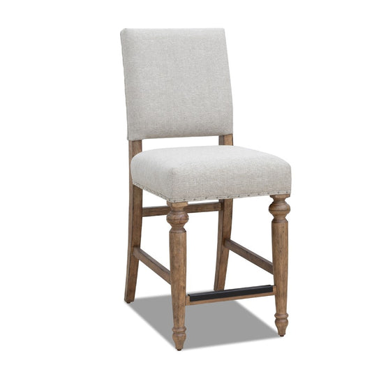 Wooden chair with light gray upholstery and decorative legs.