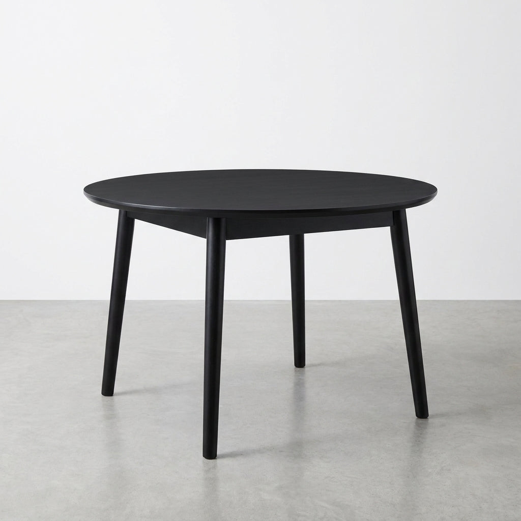 Round black table with four legs.