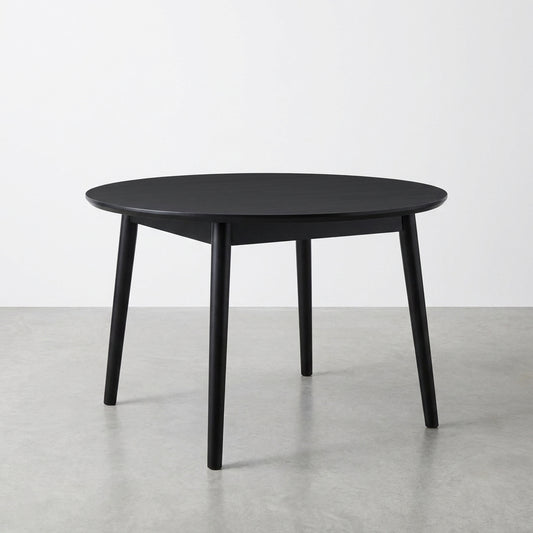 Round black table with four legs.