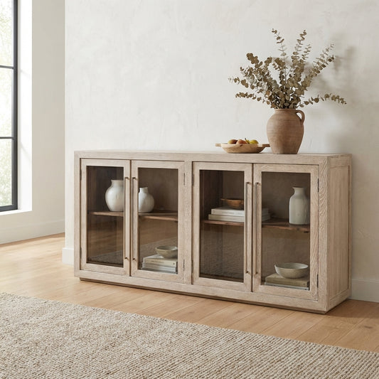 Light wood cabinet with glass doors and shelves.