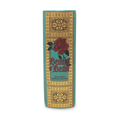 "Beauty and the Beast" book spine with ornate design and red rose.