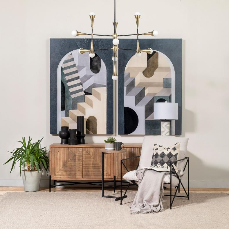 Stylish room with abstract art, modern chair, and geometric chandelier.