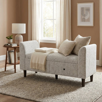Gray upholstered bench with storage and dark wooden legs.