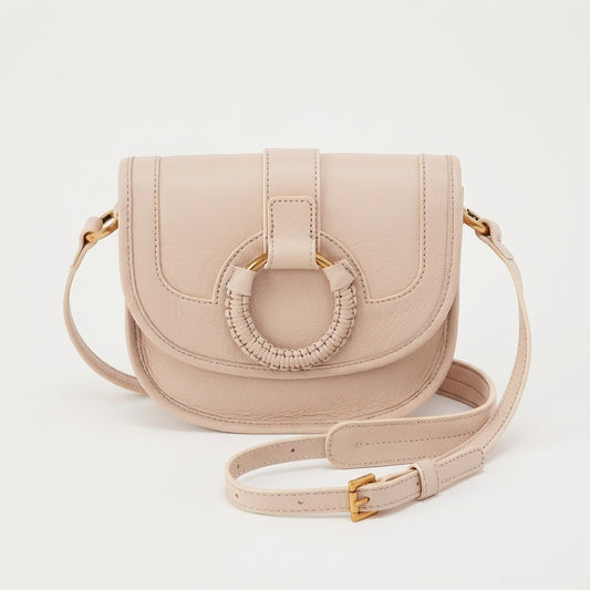 Beige crossbody bag with circular braided detail.