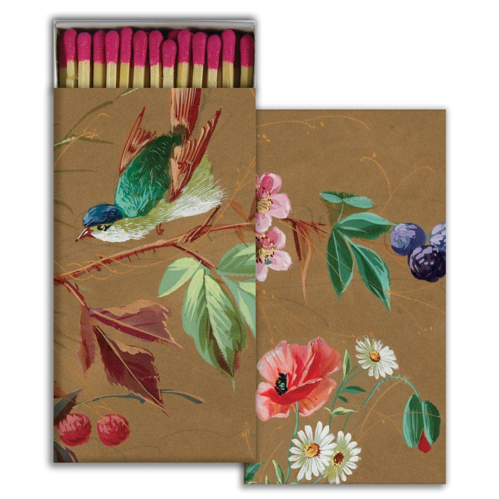 Elegant matchbox with a floral and bird design.