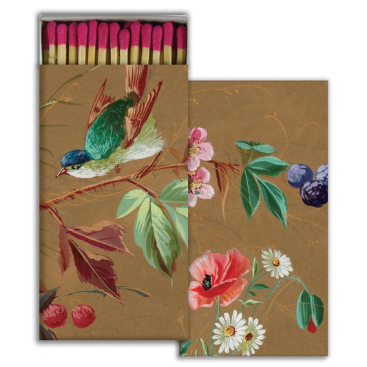 Elegant matchbox with a floral and bird design.