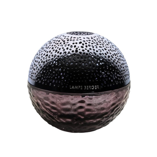 Round textured glass item with perforated top, labeled "Lampe Berger."