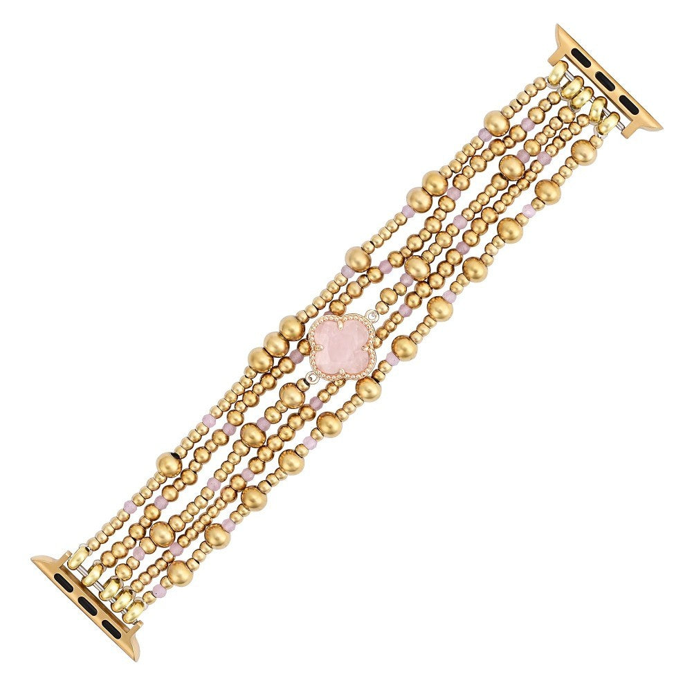 Elegant gold and pink beaded watch band with a central floral accent.