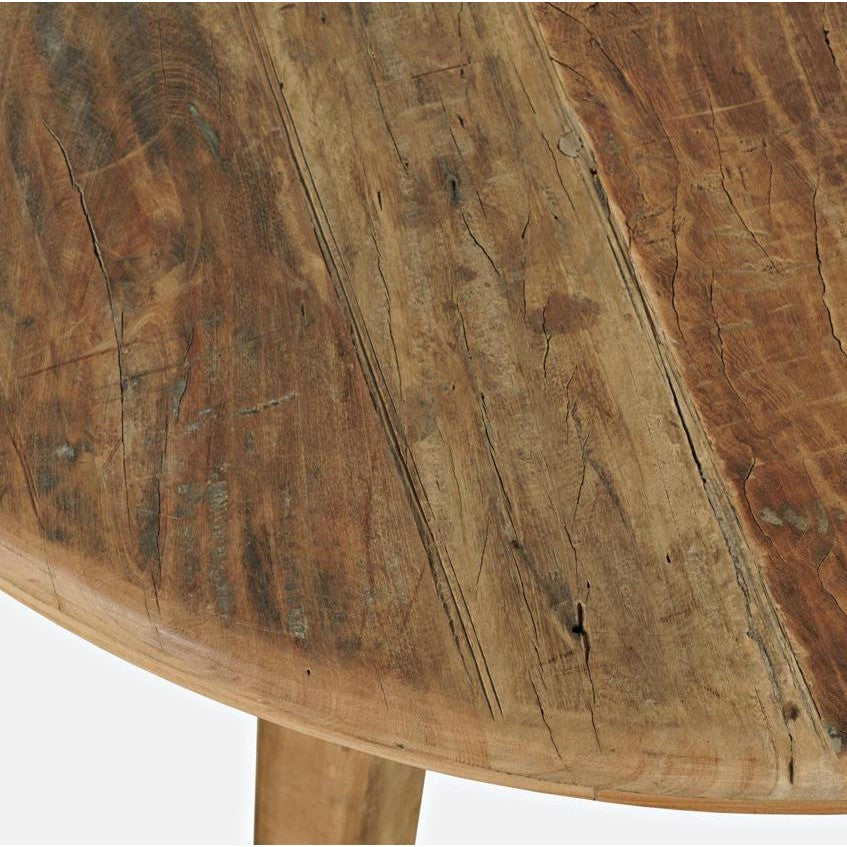 Close-up of a rustic, weathered wooden table surface.
