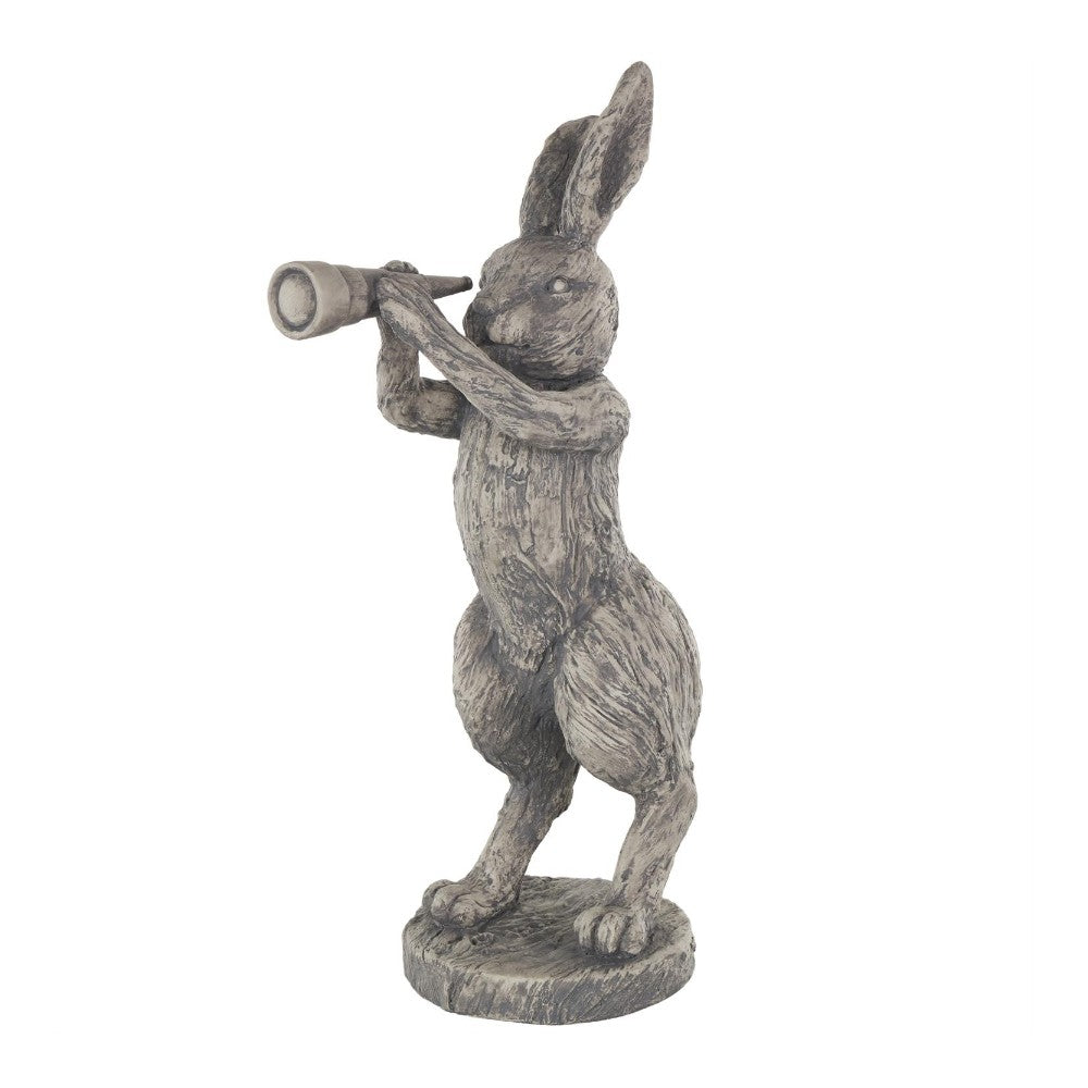 Rabbit statue looking through a telescope.