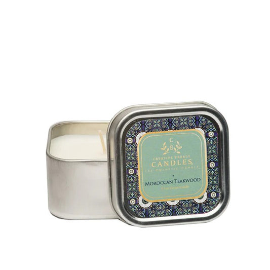 Square tin candle with intricate lid design, labeled "Moroccan Teakwood."