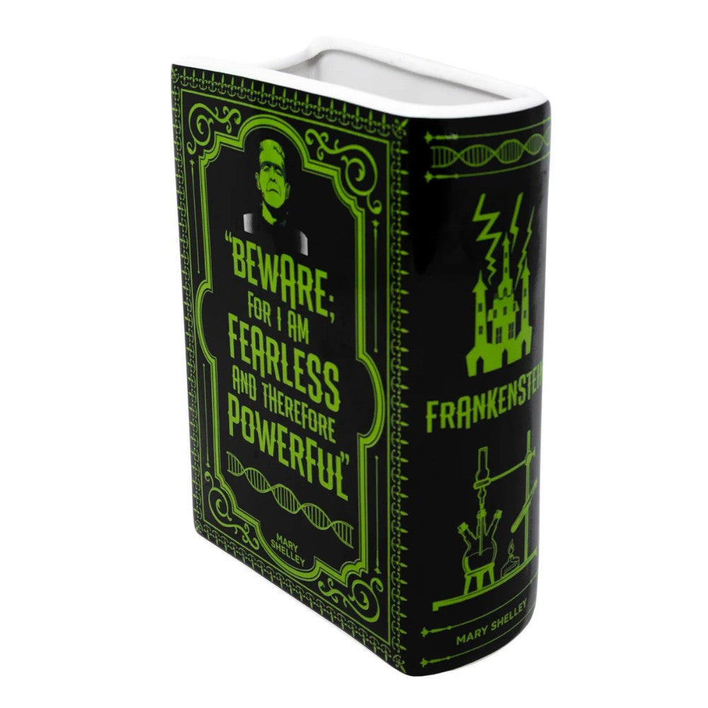 Frankenstein-themed book vase with green accents and a powerful quote.