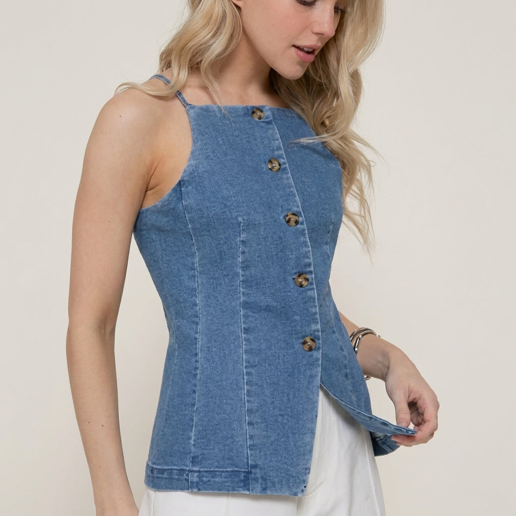 Woman in a denim top with button detailing.