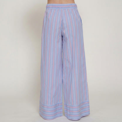 Striped wide-leg pants in pastel blue and pink against a plain background.