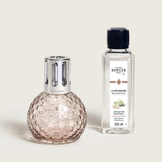Textured glass fragrance lamp with refill bottle.