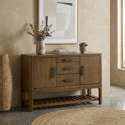 Wooden sideboard with decor, abstract art, and neutral walls.