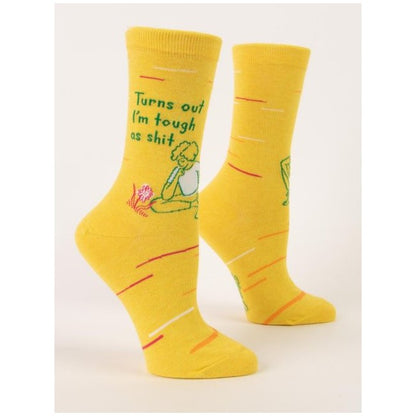 Two yellow socks with motivational text and a seated figure illustration.