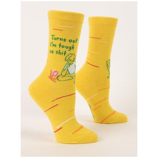 Two yellow socks with motivational text and a seated figure illustration.