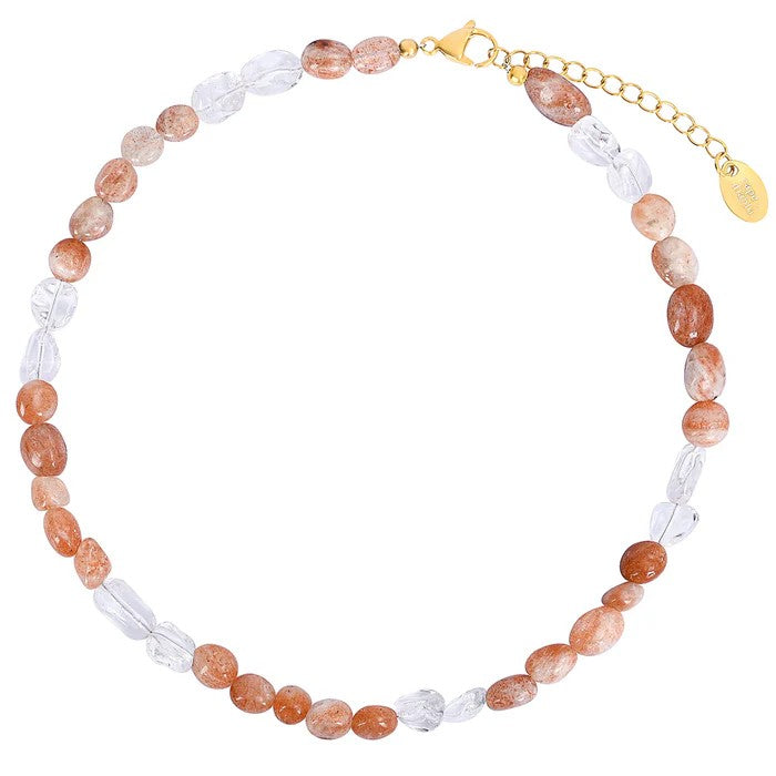 Beaded necklace with orange and clear stones, gold clasp.