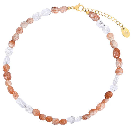 Beaded necklace with orange and clear stones, gold clasp.