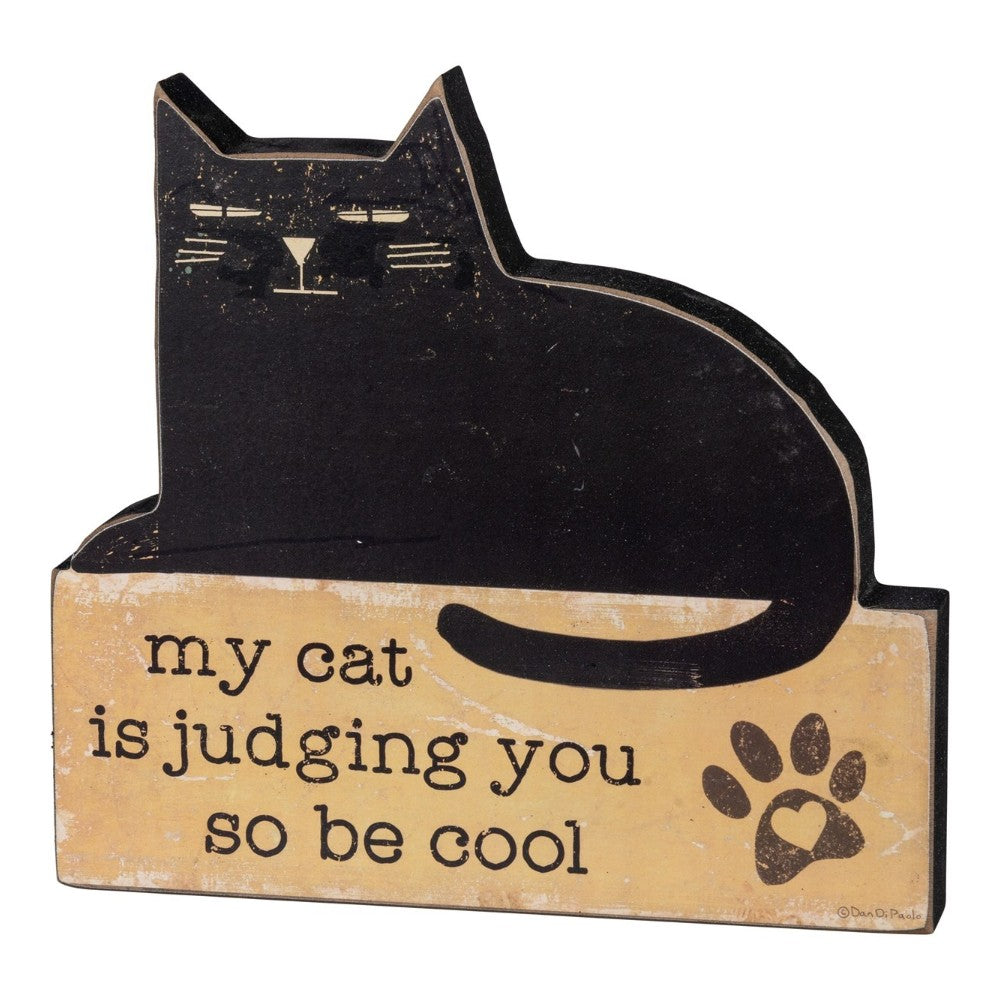 Black cat sign: "my cat is judging you so be cool" with paw print.