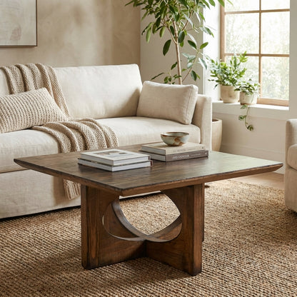 Modern wooden square table with circular cut-out base design.
