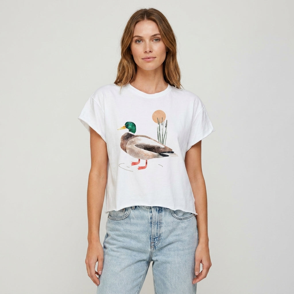 Person wearing a duck-themed white T-shirt and jeans.