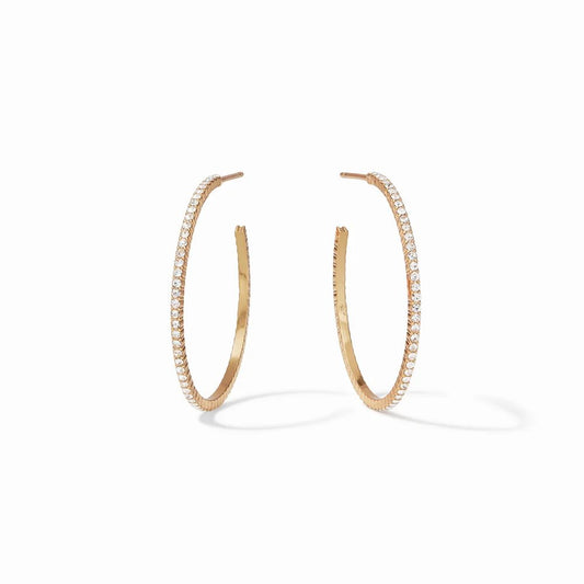 A pair of gold hoop earrings adorned with sparkling stones.