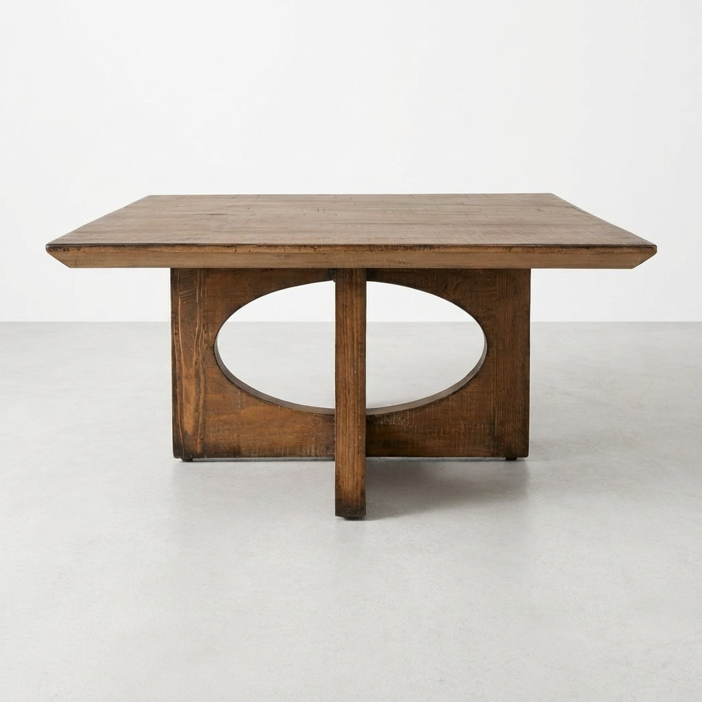 Wooden table with an oval cutout base and rectangular top.