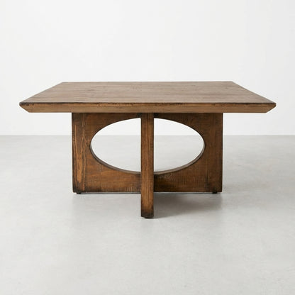 Wooden table with an oval cutout base and rectangular top.