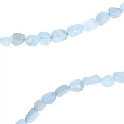 Pale blue aquamarine stone beads on a white background.