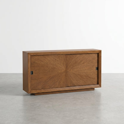 Wooden cabinet with sliding door and open shelves on each side.