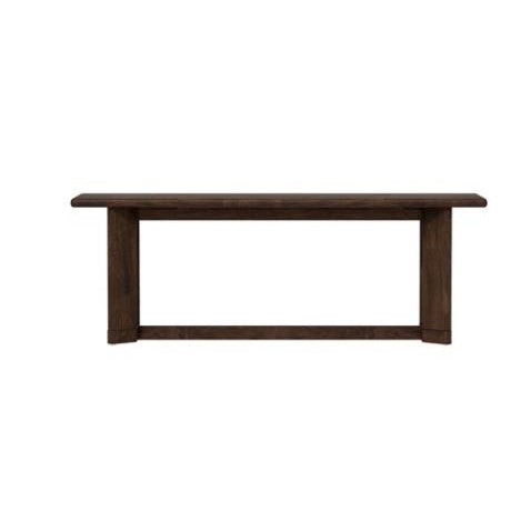 A long, dark wooden table with a minimalist design.