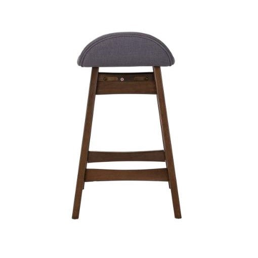 Wooden stool with a curved, upholstered seat in gray.