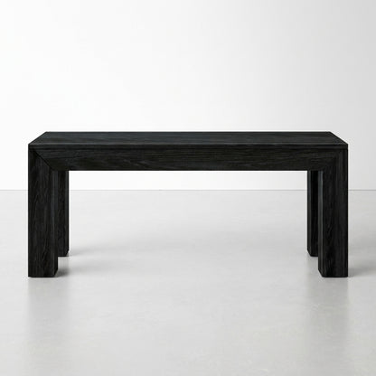 Black wooden table in a minimalistic setting.