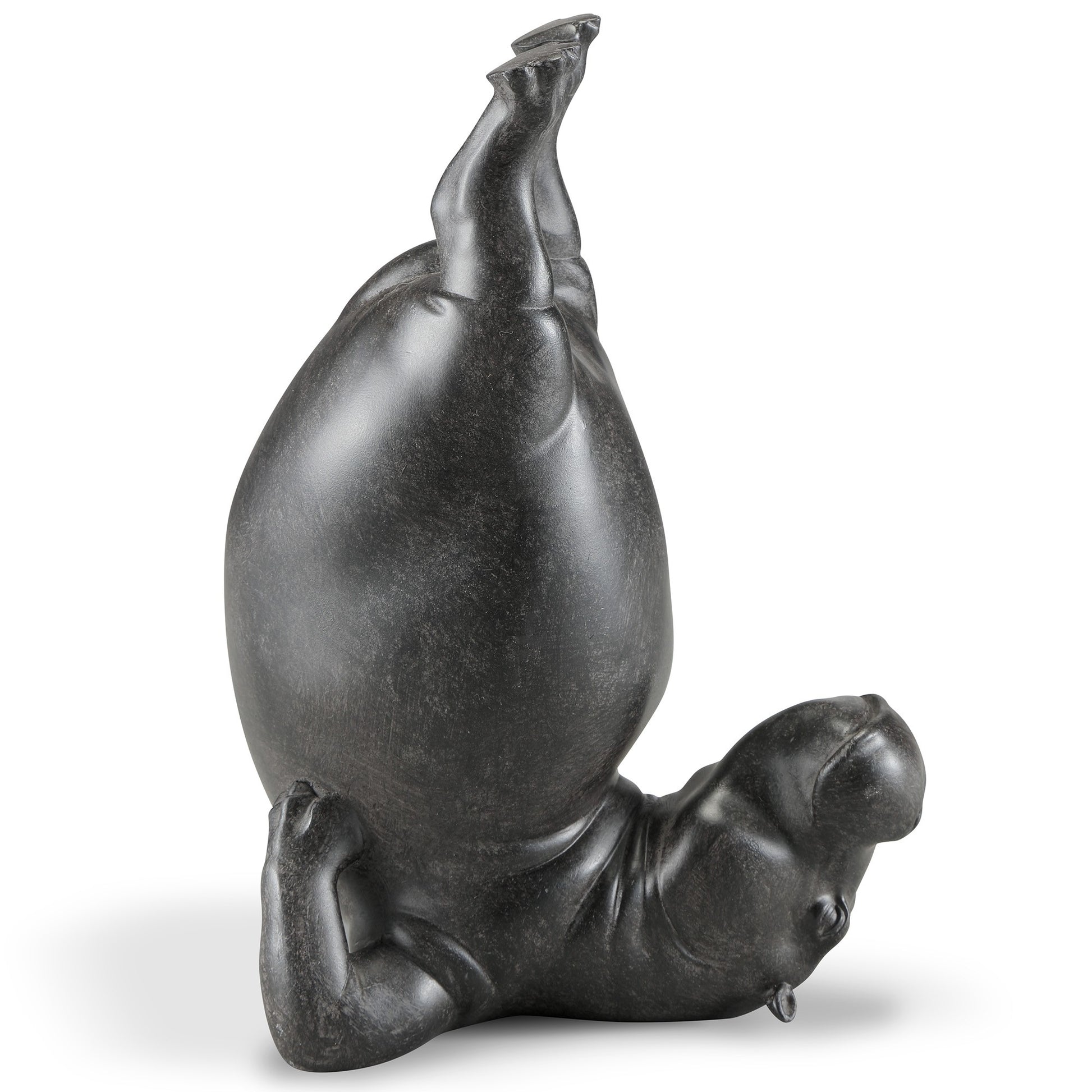 Upside-down hippo sculpture striking a playful pose.
