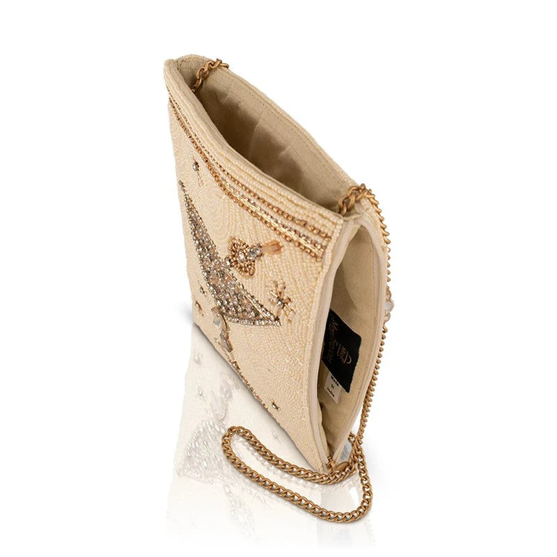 Elegant beaded clutch with gold chain and star design.