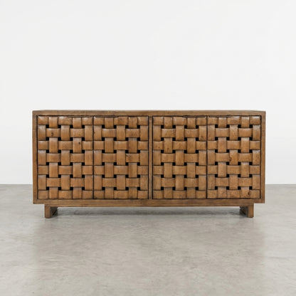 Wooden sideboard with woven pattern and open door revealing shelves.