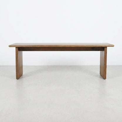 Simple wooden bench with a flat top and sturdy legs.