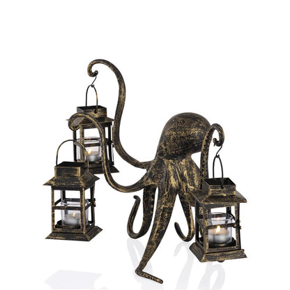 Bronze octopus holding lanterns with lit candles.